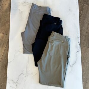 Greg Norman Golf Slacks 3 pr navy, grey & greenish-grey. 32w x 29 length